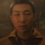 BTS’ RM Plays Multiple Roles (Including a Baby Man) in Cinematic Video For Solo Single ‘Come Back To Me’