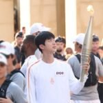 jin paris olympic torch Courtesy of BIGHIT MUSIC 2024 billboard 1548