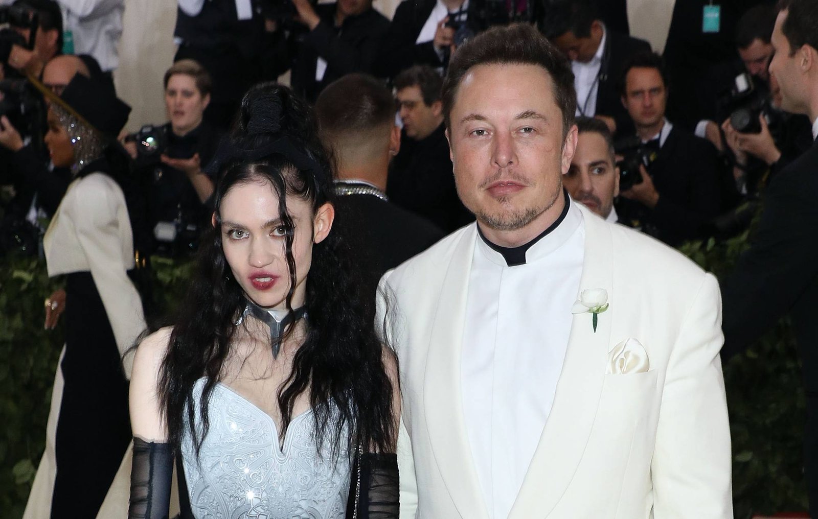 Grimes and Elon Musk posing